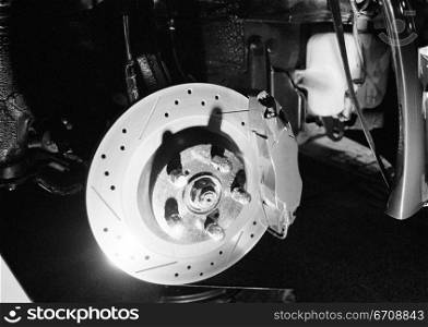Close-up of a wheel hub in auto repair shop