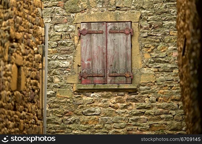 Close-up of a window on a stone wall