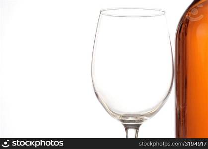 Close-up of a wineglass and a wine bottle