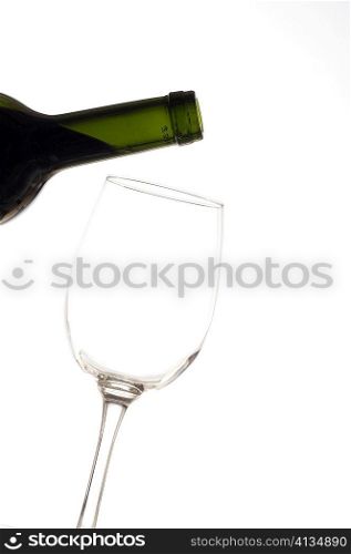 Close-up of a wineglass and a wine bottle