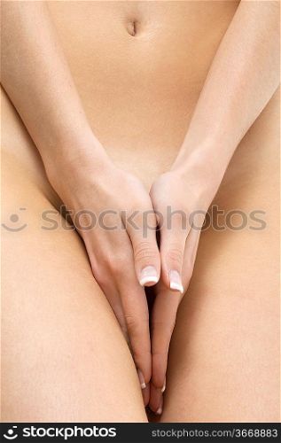 close up of a woman body with close hands between the legs