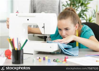 close up of a woman during sewing process