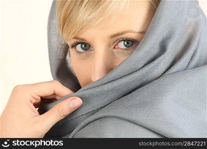 close-up of a woman face wearing a headkerchief