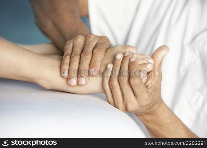 Close-up of a woman getting a foot massage