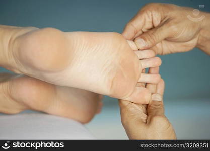 Close-up of a woman getting a foot massage