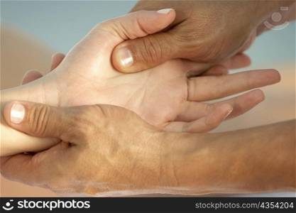 Close-up of a woman getting a hand massage