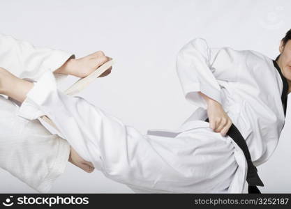 Close-up of a woman practicing kickboxing