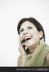 Close-up of a woman using a headset and smiling