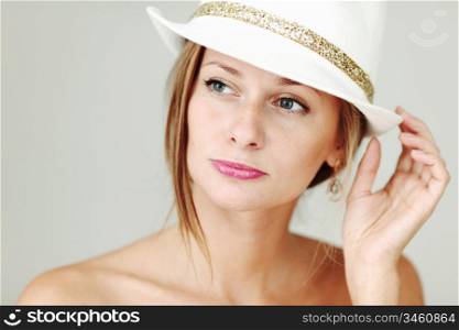 Close up of a woman wearing a hat