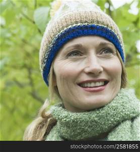 Close-up of a woman wearing a knit hat and smiling