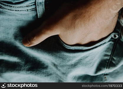 Close up of a woman wearing mom jeans over a rainbow lgbt bench at the park