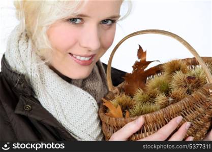 close-up of a woman with chestnut basket