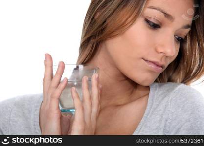 close-up of a woman with glass of water