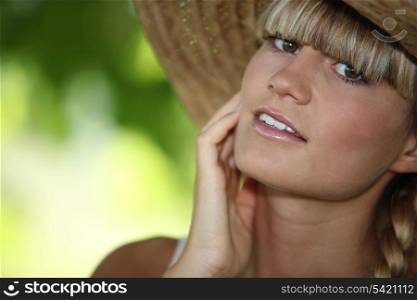 close-up of a woman with straw hat