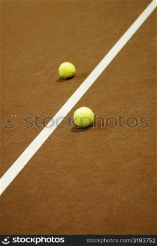 Close-up of a yard line between two tennis balls