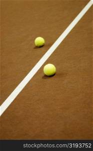 Close-up of a yard line between two tennis balls