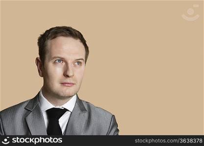 Close-up of a young businessman looking away