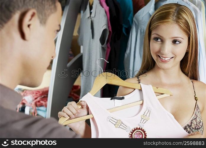 Close-up of a young couple choosing clothes in a store