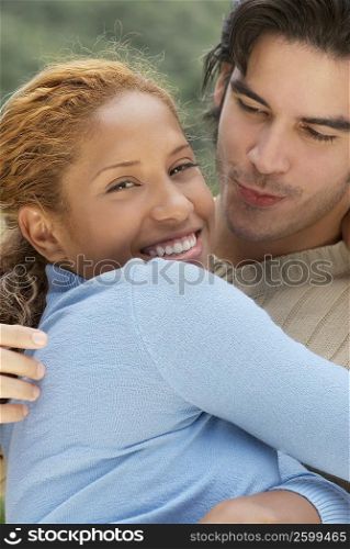 Close-up of a young couple embracing each other