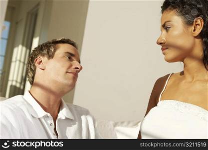 Close-up of a young couple facing each other