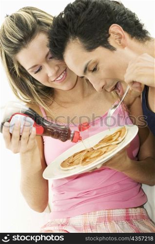Close-up of a young couple having breakfast