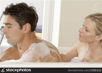 Close-up of a young couple in a bathtub
