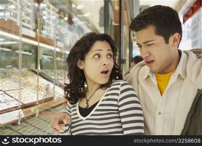 Close-up of a young couple in a jewelry store