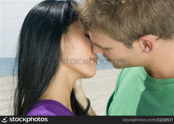 Close-up of a young couple kissing