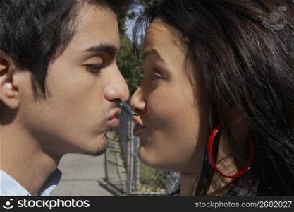 Close-up of a young couple kissing each other