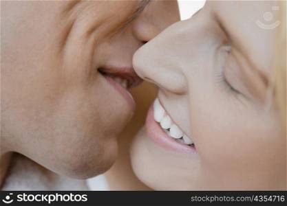 Close-up of a young couple kissing each other