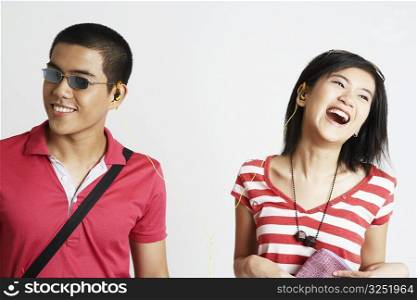 Close-up of a young couple listening to music