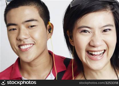 Close-up of a young couple listening to music