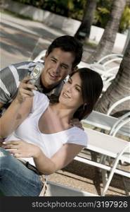 Close-up of a young couple looking at a mobile phone