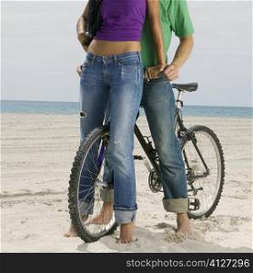 Close-up of a young couple on a bicycle