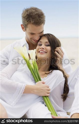 Close-up of a young couple on the beach