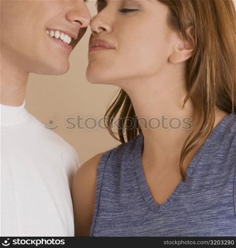 Close-up of a young couple rubbing their noses
