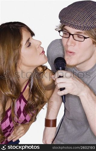 Close-up of a young couple singing together