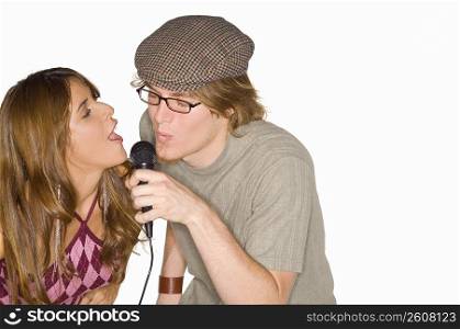 Close-up of a young couple singing together