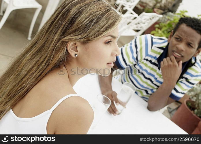 Close-up of a young couple sitting at the table