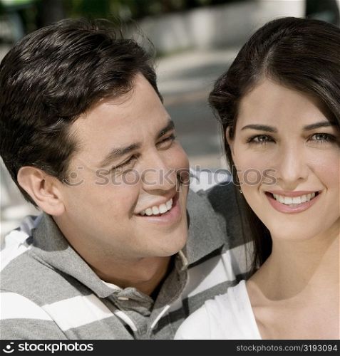 Close-up of a young couple smiling