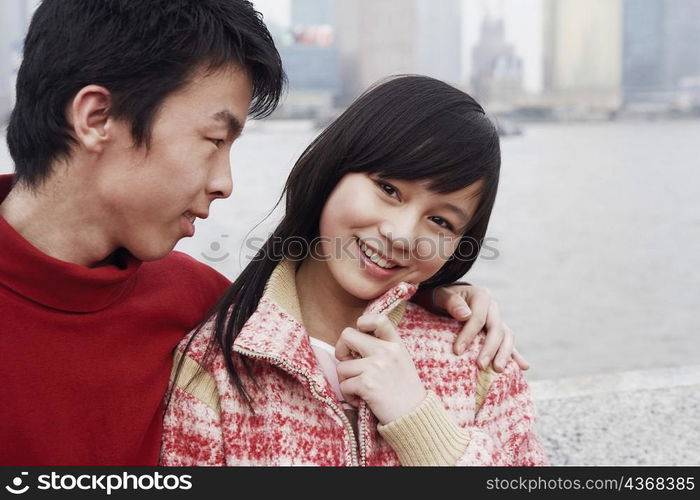 Close-up of a young couple smiling