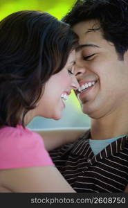 Close-up of a young couple smiling together