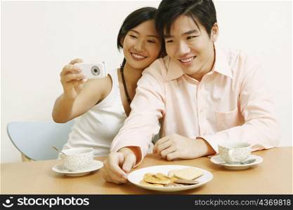 Close-up of a young couple taking a picture of themselves