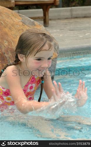 Close-up of a young girl (12 -13) playing in water, Moorea, Tahiti, French Polynesia, South Pacific