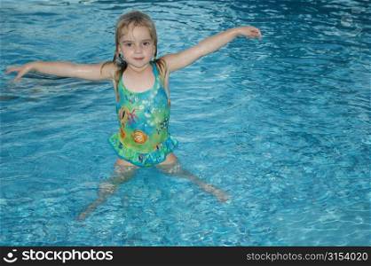 Close-up of a young girl in a swimming pool, Moorea, Tahiti, French Polynesia, South Pacific