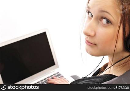 Close up of a young girl on isolated background working on the computer