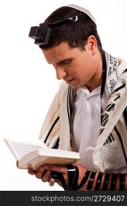 Close up of a young jewish man with book on white isolated background