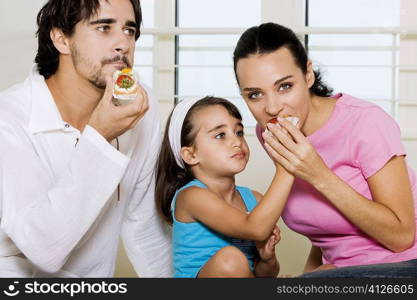 Close-up of a young man eating a pastry