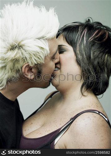 Close-up of a young man embracing a mid adult woman