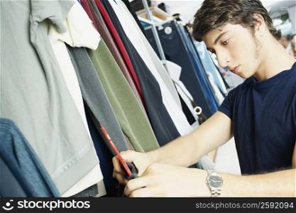 Close-up of a young man in a clothing store